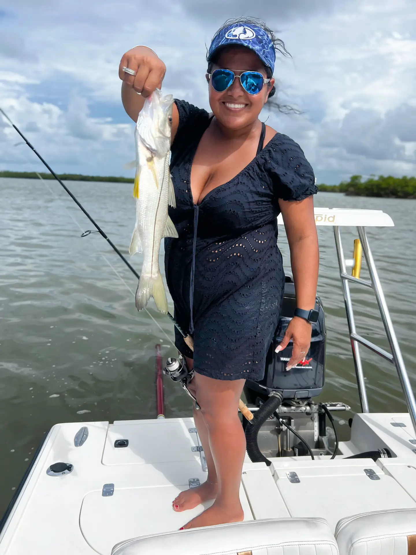 Women Showing Fish