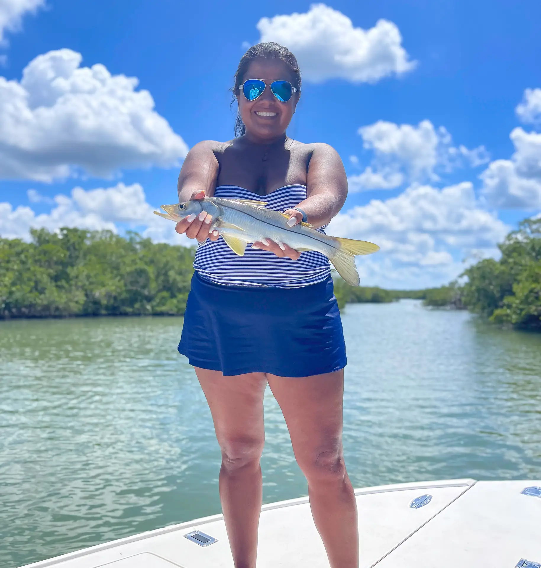 Women Holding Fish